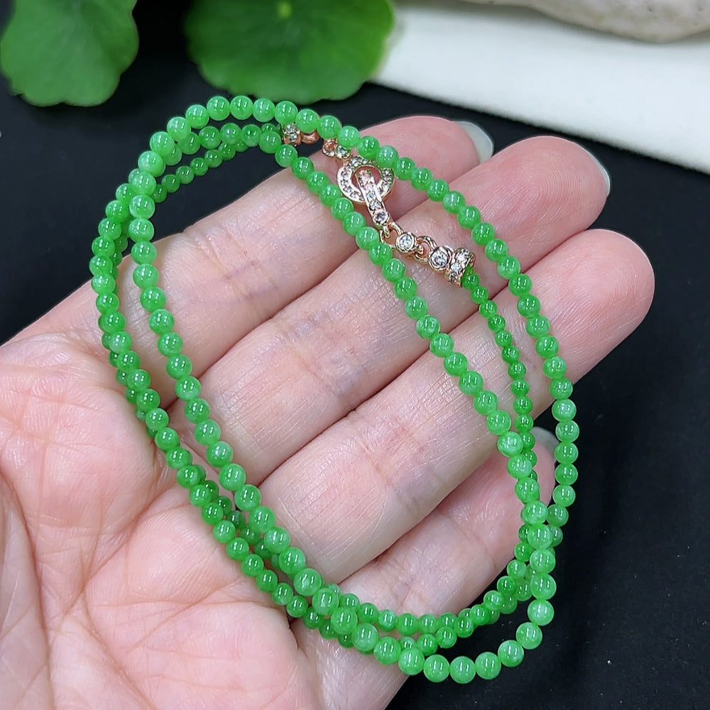 Jadeite bead necklace with 2.8mm beads, non-gold setting, from HKHQ, showing the smooth, polished jade beads and necklace length.