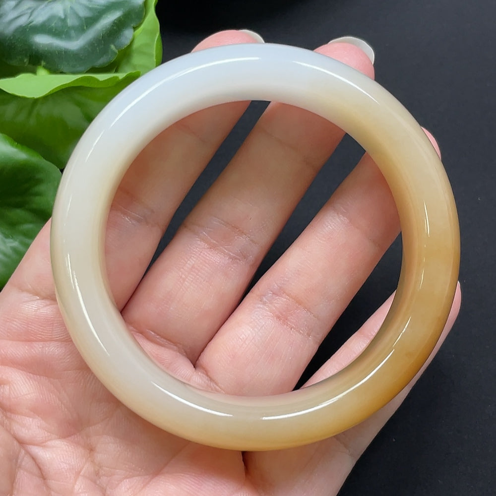 HKHQ Hetian Jade round bangle, size 55.2, weighing 83.44g, showcasing smooth polished surface and natural jade color.