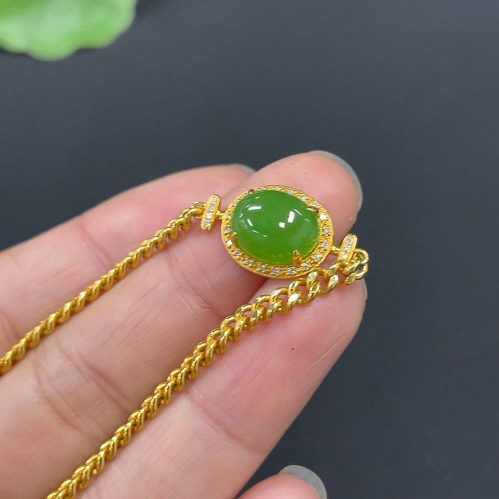 Hetian jade Jasper cabochon bracelet with 18K gold inlay and diamond accents, featuring a delicate, elegant jewelry design.