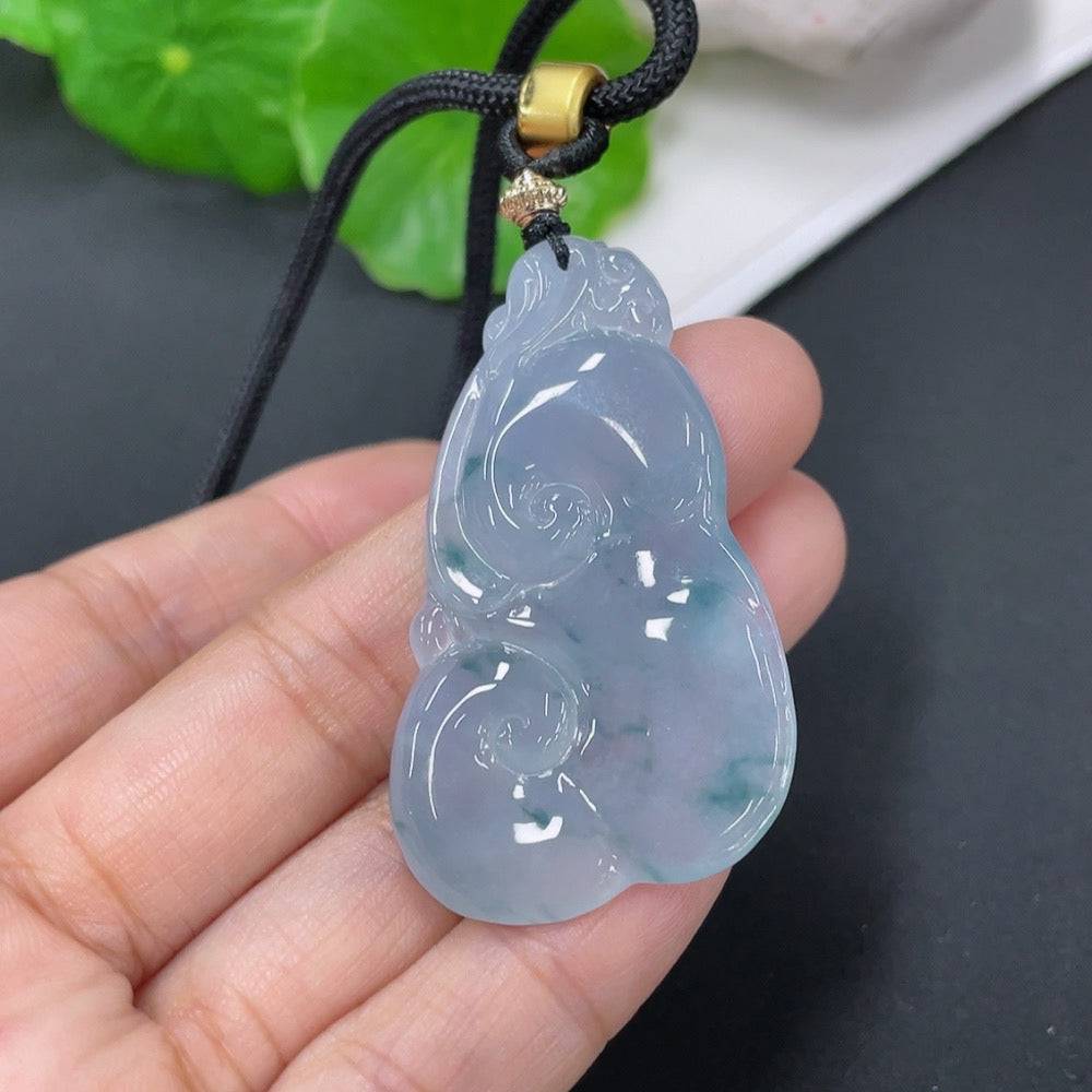 Jadeite pendant Ruyi with rope, crafted from green jade, weighing approximately 15.72g, featuring intricate carved details.