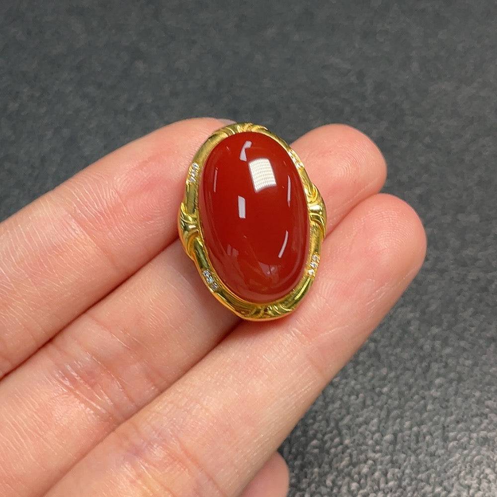 Huiliu HQ red agate gemstone jewelry piece featuring vibrant red polished agate stone with natural patterns and a sleek design.