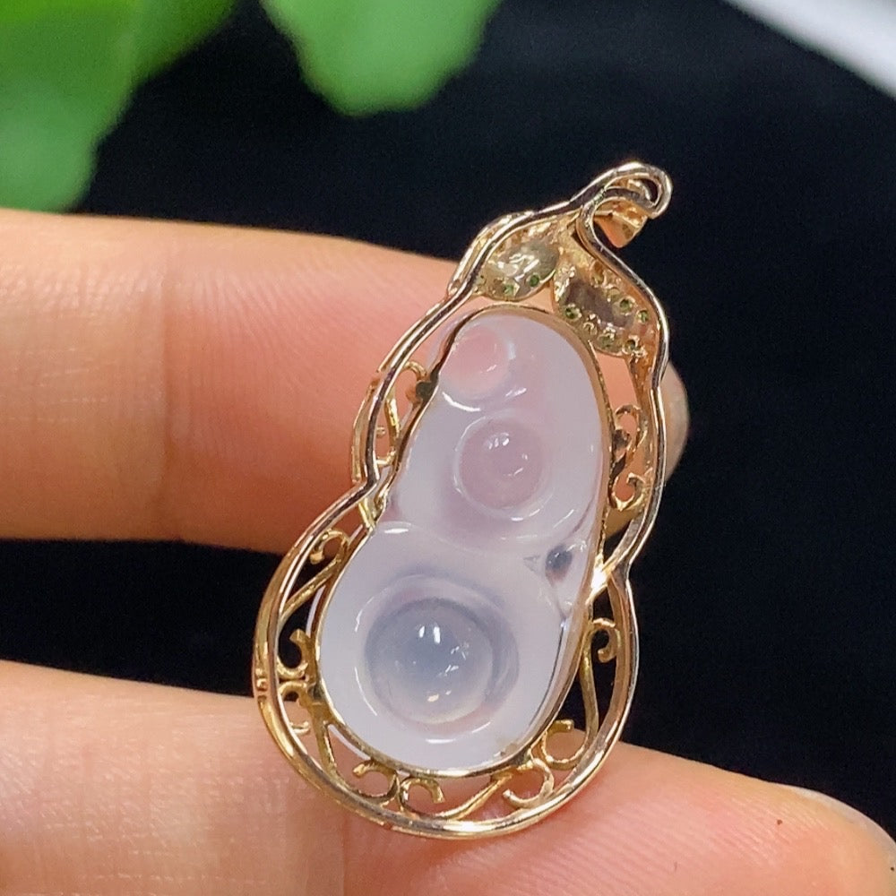 Huiliu Jadeite gourd pendant with intricate inlaid design, showcasing vibrant green jade in a natural shape.