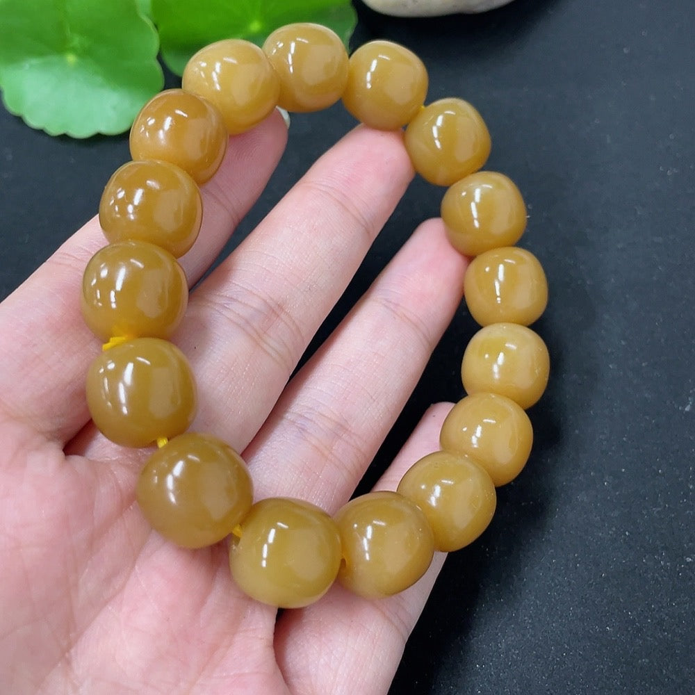 HKHQ Hetian Jade bracelet showcasing smooth, polished jade stones with a traditional clasp design.