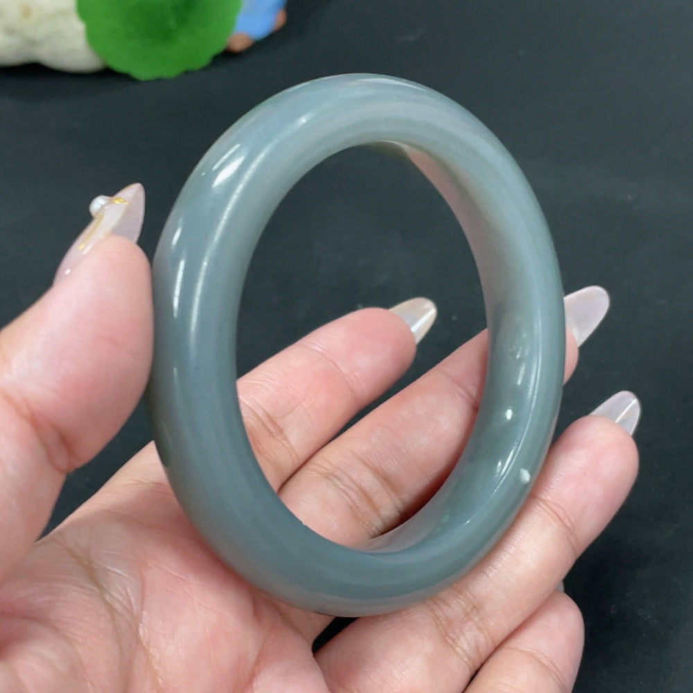 Huiliu certified Hetian jade round bracelet featuring smooth, polished green jade beads on a string, natural and elegant jewelry piece.