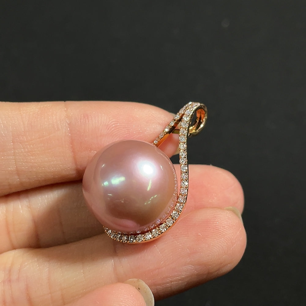 Elegant pearl pendant necklace by HKHQ featuring diamond accents on 18k gold, with a 15.7mm pearl and total weight of 7.35g.