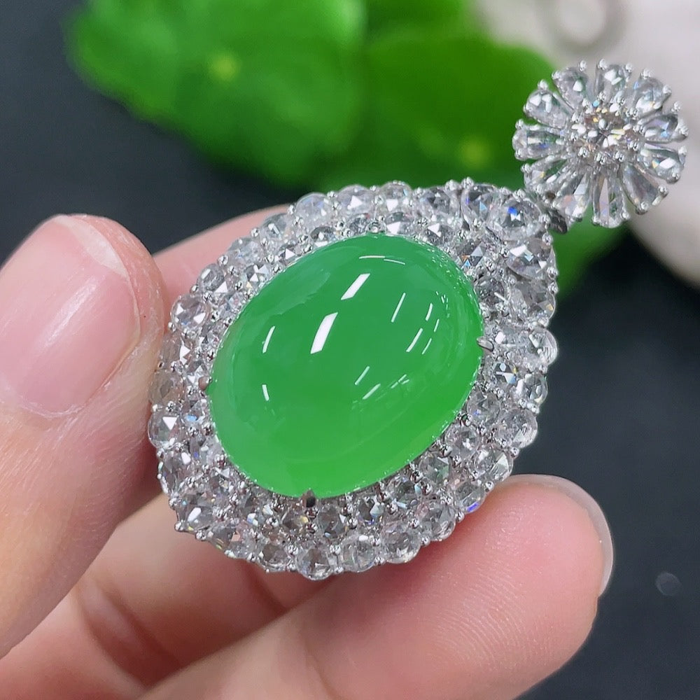 Jadeite inlaid cabochon pendant with 18K gold and diamond accents, featuring a elegant necklace design.