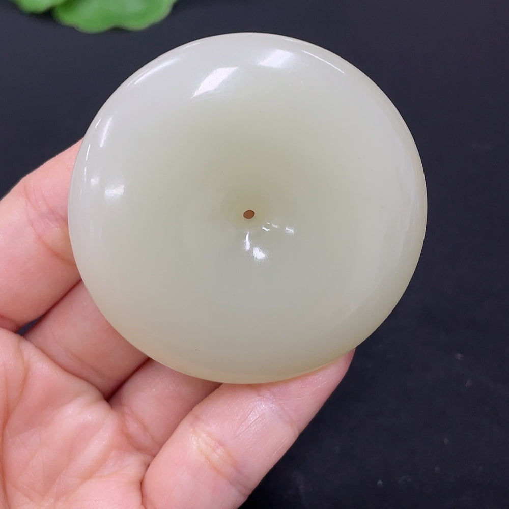 Hetian jade pendant with peace knot design, crafted from high-quality jade, weighing approximately 58.6 grams.