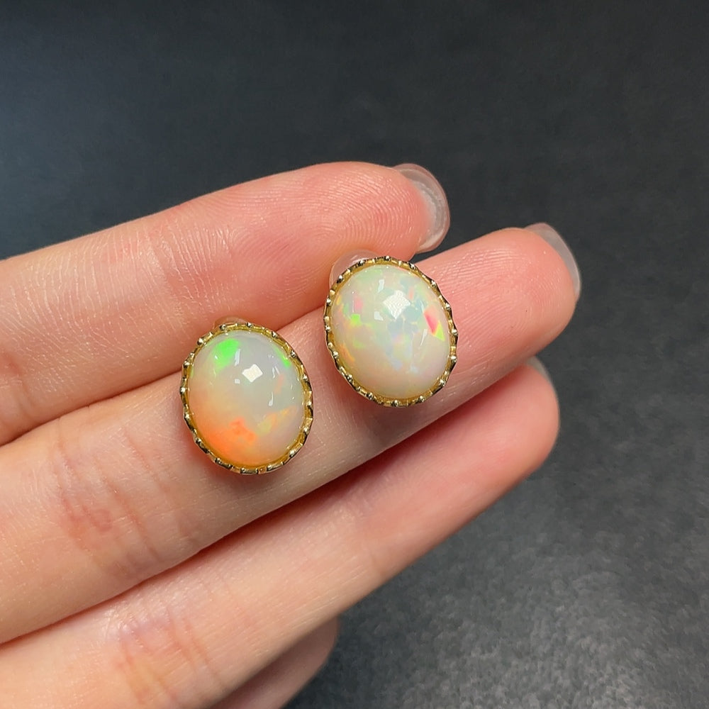 Huiliu Certified opal gemstone earrings with 37% content, featuring vibrant, iridescent opal stones in a stylish jewelry design.