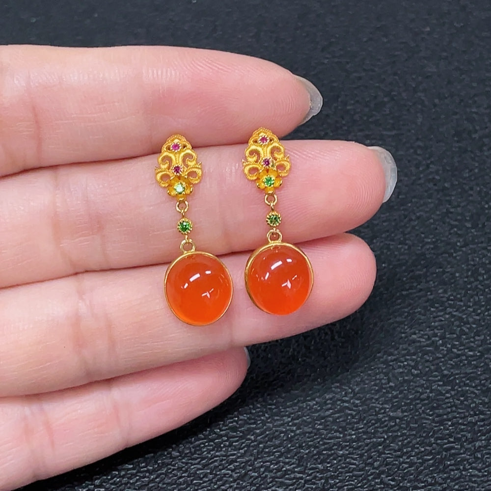 Red agate gemstone earrings with 18K gold accents, featuring non-natural accent stones and a total weight of 2.95g.
