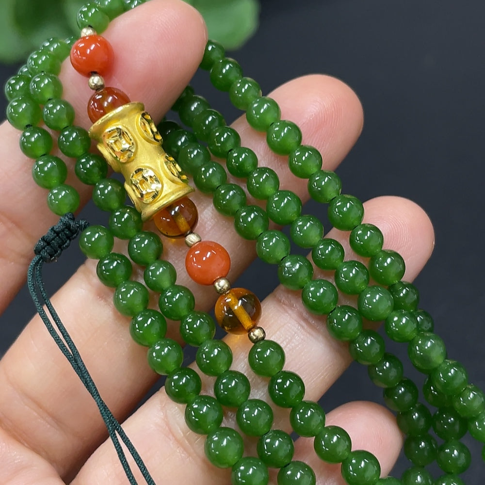 Hetian Jade beaded necklace featuring smooth, round jade beads strung on a delicate cord, showcasing elegant craftsmanship.