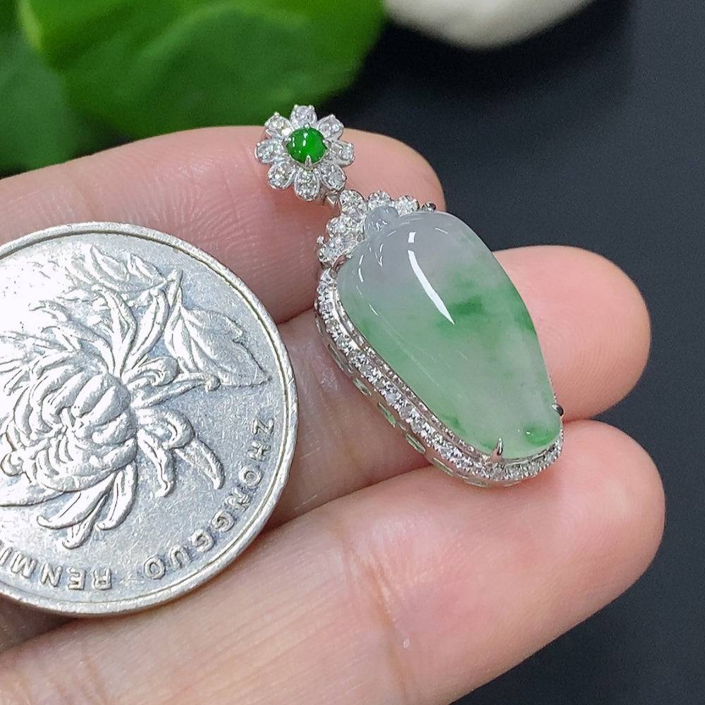 Jadeite pendant with 18K gold setting, accented with diamonds, weighing approximately 3g, featuring a polished green jade gemstone.
