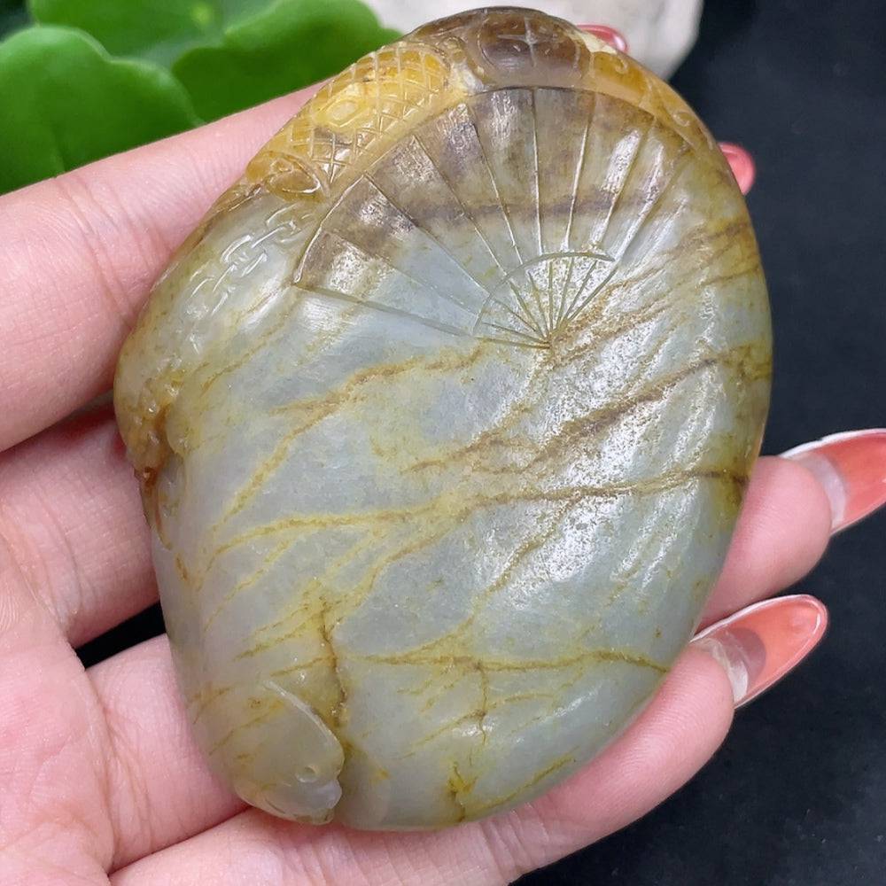 Huiliu HQ Hetian Jade handheld carving of Zhong Kui with detailed craftsmanship, showcasing smooth jade surface and intricate design.