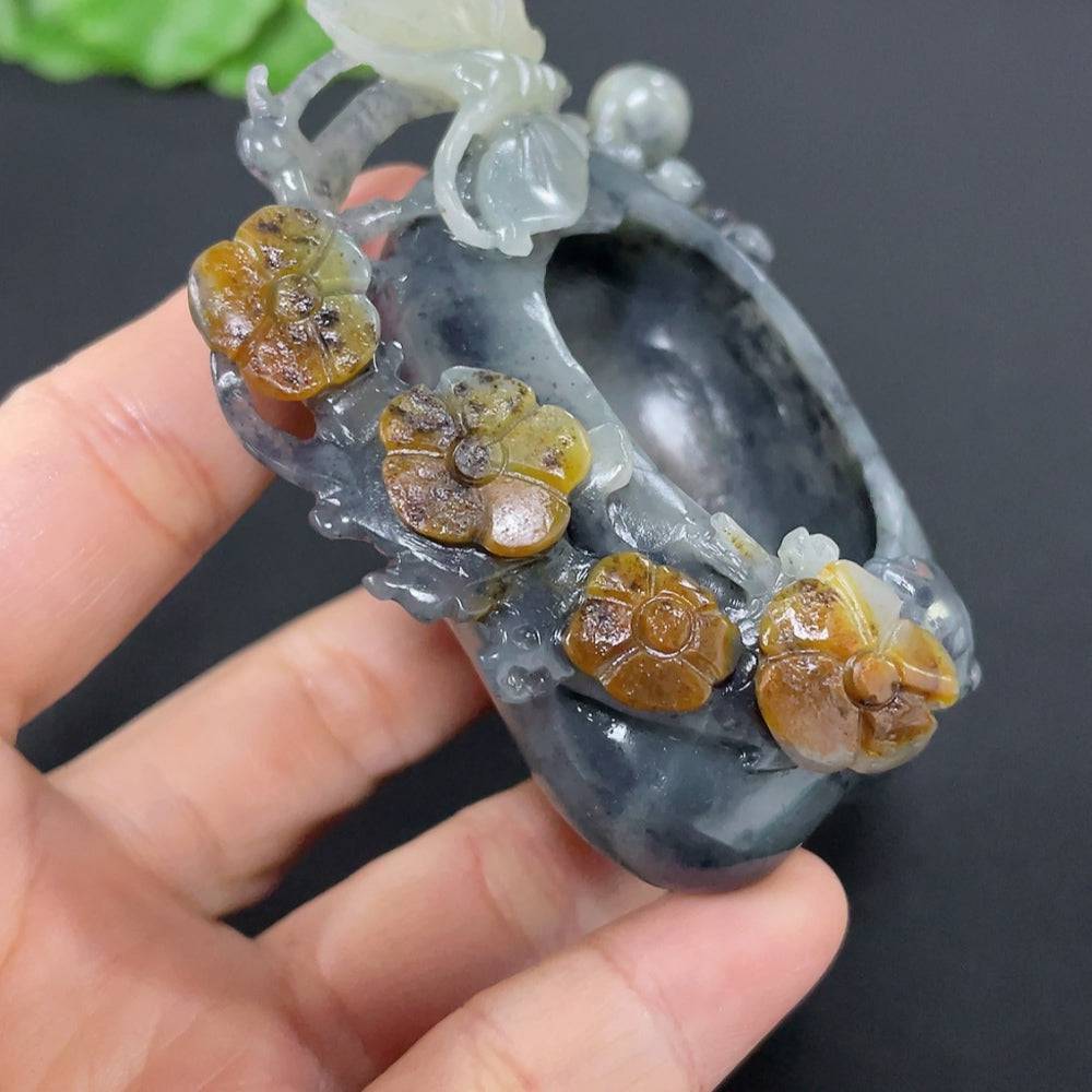 Huiliu Hetian Jade butterfly and flower ornament with mineral inclusions, crafted in natural jade with detailed butterfly and floral carvings.