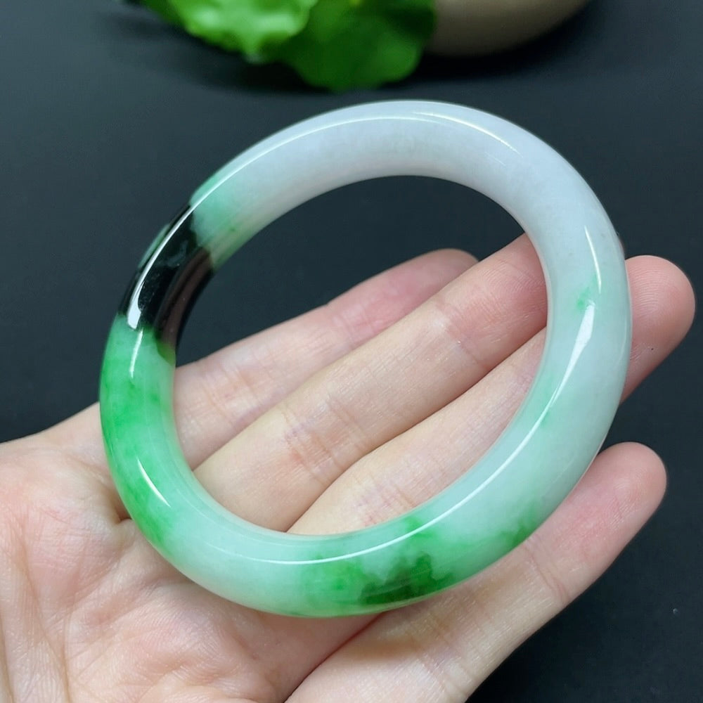 HKHQ jadeite round bangle in size 52.5, featuring a smooth, polished surface and weighing 51.35 grams.