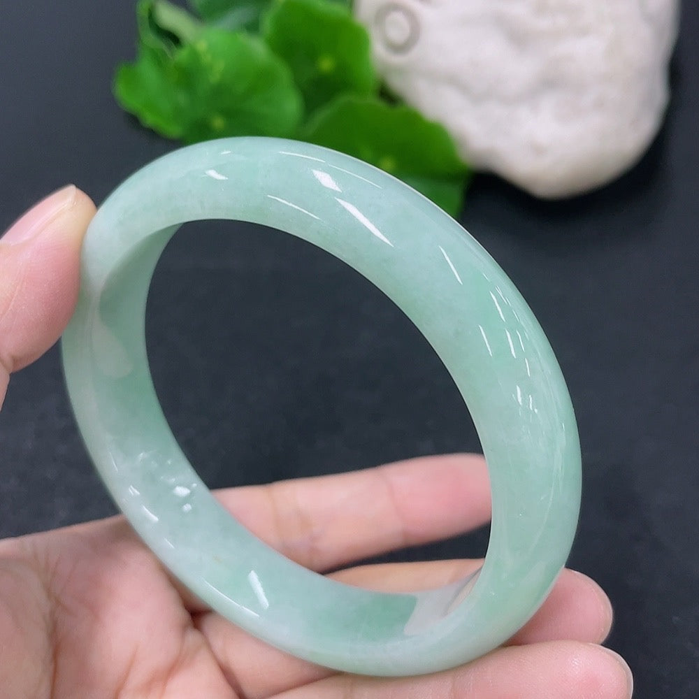 Jadeite round bracelet with 58mm diameter and 54.45g weight, crafted by HKHQ, showing smooth, polished jade surface.