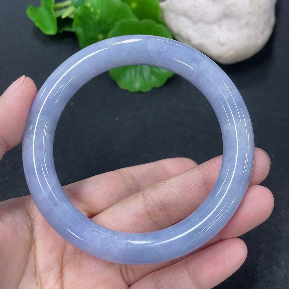 Jadeite round bangle with 56mm diameter, weighing approximately 54g, showcasing smooth, polished green jade from HKHQ.