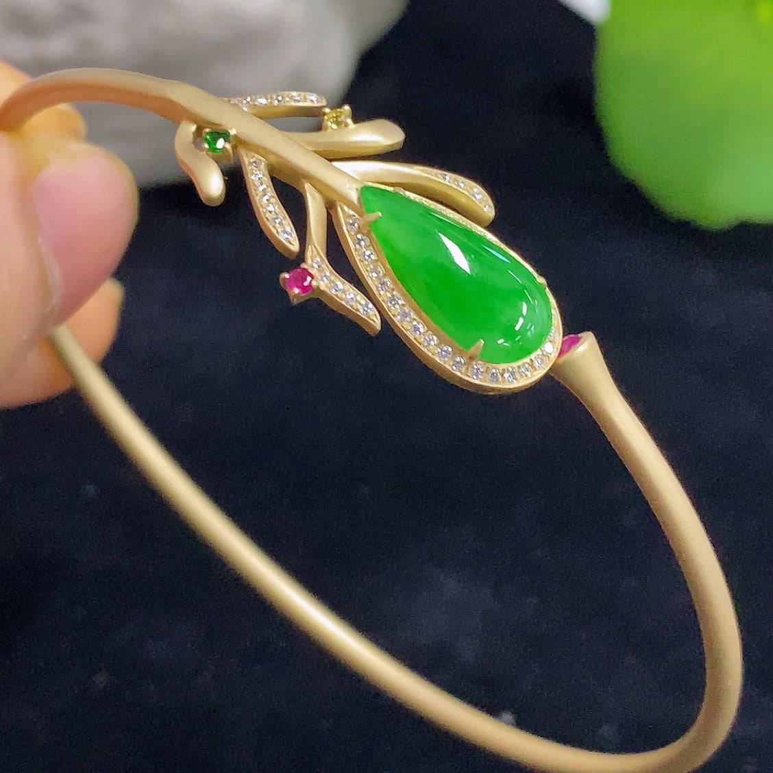 Jadeite bangle in 18K gold with sparkling colorless diamond accents, elegant bracelet by HKHQ.