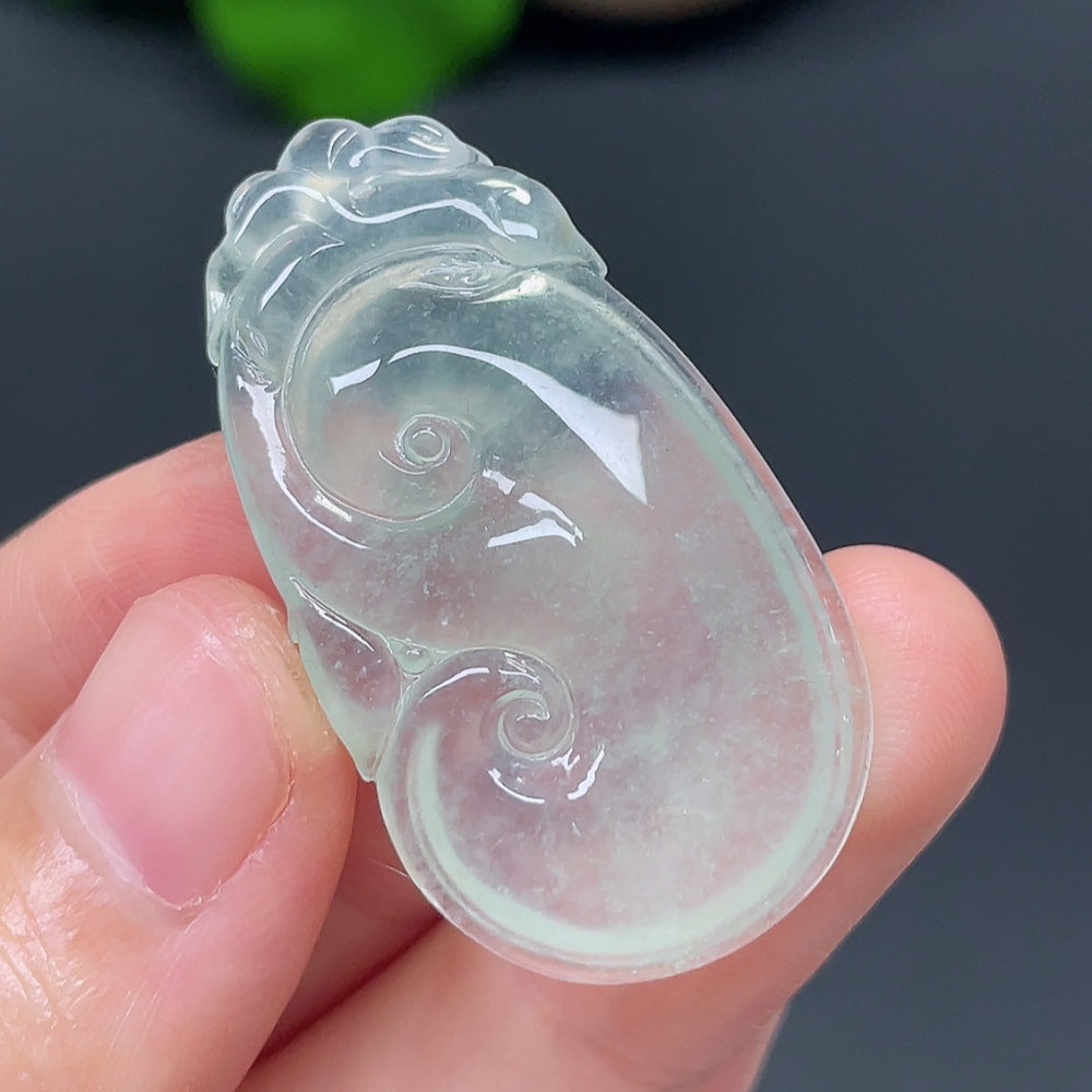 Jadeite Ruyi pendant with intricate carvings, weighing approximately 7.36g, showcasing smooth green jade craftsmanship.