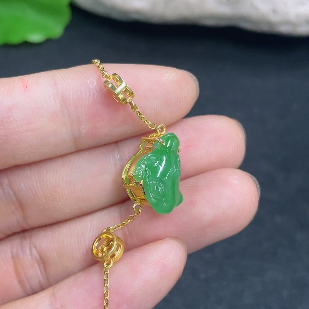 Elegant jadeite bracelet with 18K gold and diamond accents, showcasing smooth jadeite beads and sparkling diamond details.