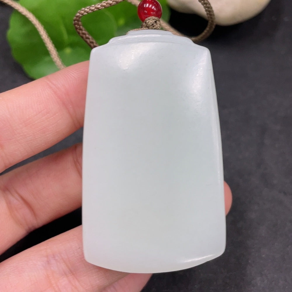 Huiliu certified Hetian jade pendant with plain design, showcasing smooth, polished jade stone on a neutral background.