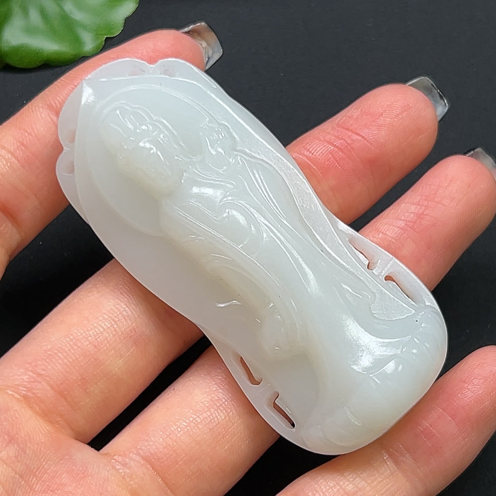 Hetian jade Guanyin pendant necklace featuring intricate carved design, crafted by HKHQ, displayed against a neutral background.
