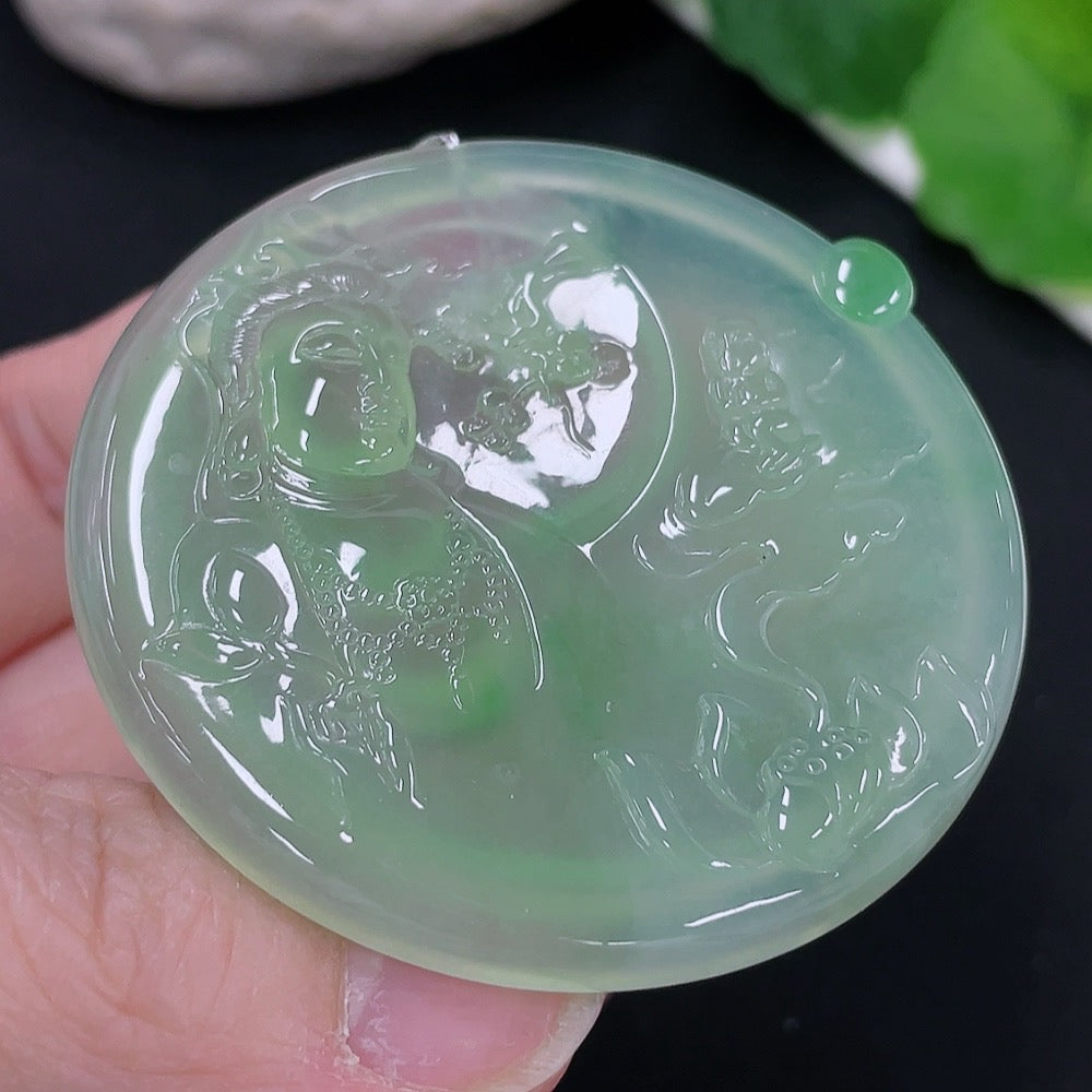 Huiliu Jadeite Guanyin pendant featuring a detailed carved figure, displayed against a neutral background.
