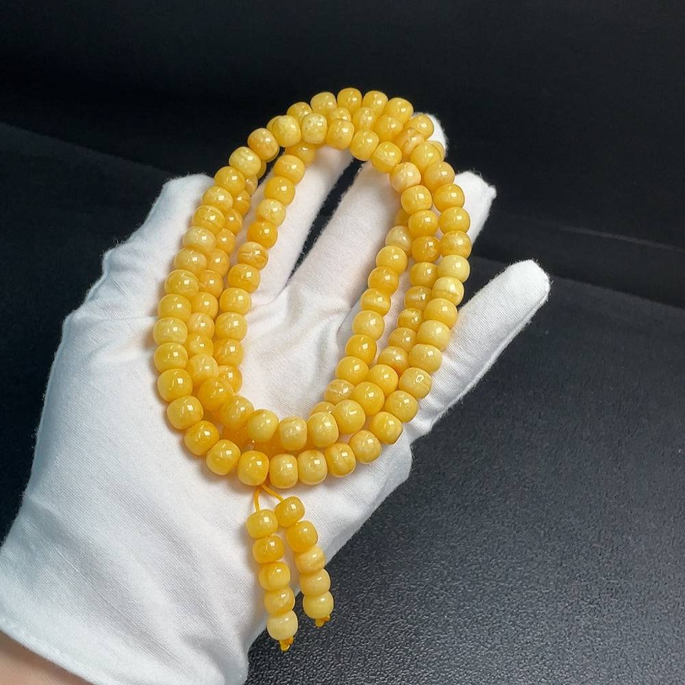 Amber Beeswax Bead Necklace by HUILIU HQ with 8.8mm beads, totaling approximately 45.64g, displayed on a neutral background.