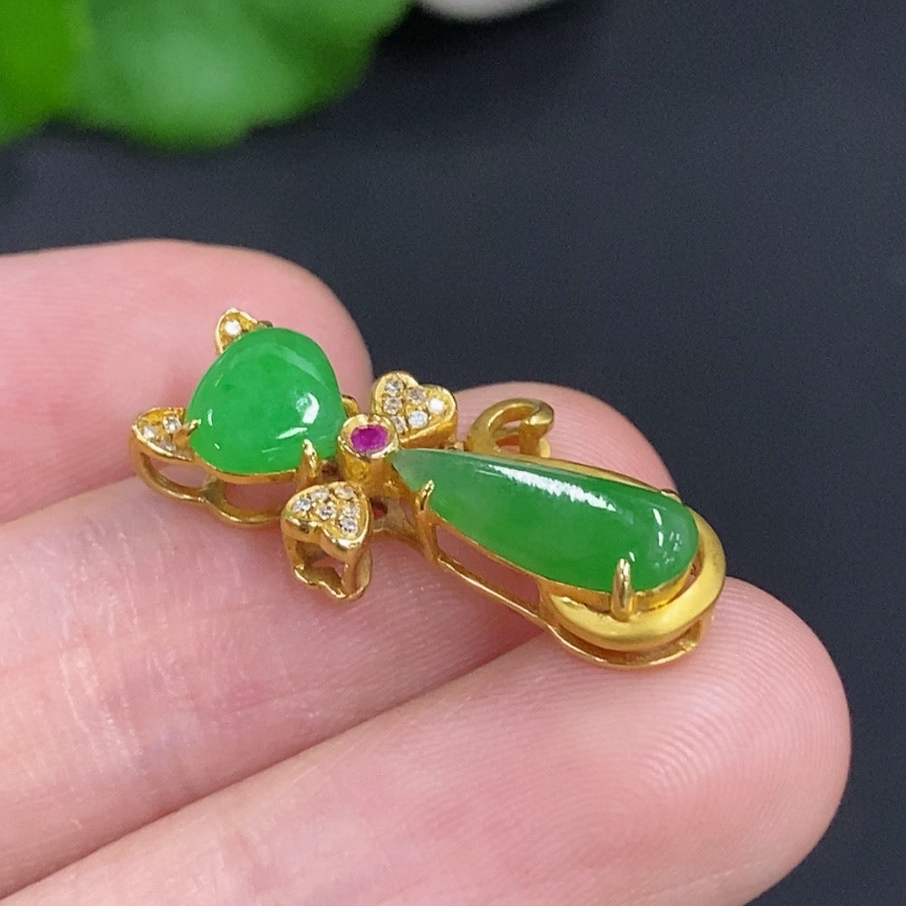 Jadeite pendant with diamond accents mounted in 18K gold, designed as a necklace, showcasing elegant craftsmanship.