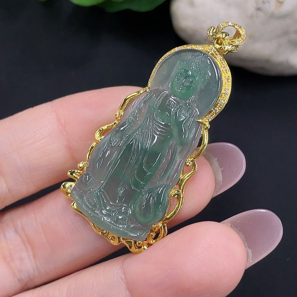 Jadeite Buddha pendant with 18K gold bail, weighing approximately 5.9g, featuring a detailed carved Buddha figure on smooth jade.