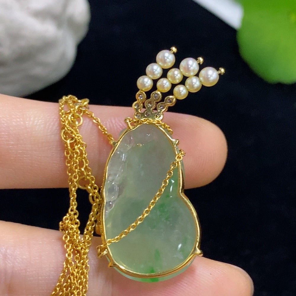 Jadeite gourd pendant set in 18k gold with diamond accents, total weight approximately 8.15g (including chain)