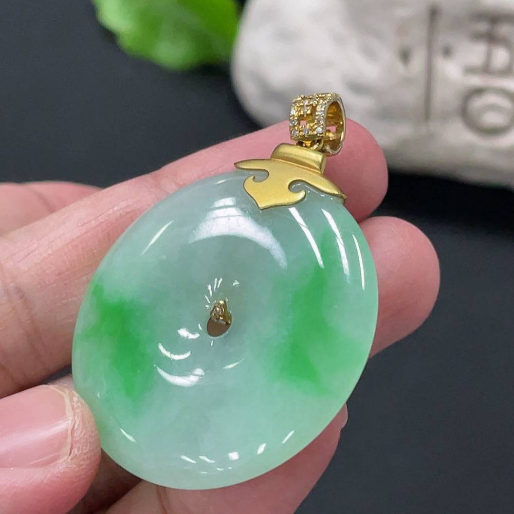 Jadeite Peace Knot pendant with 18K gold clasp and diamond accents, crafted by HUILIU HQ, showcasing intricate jade jewelry design.