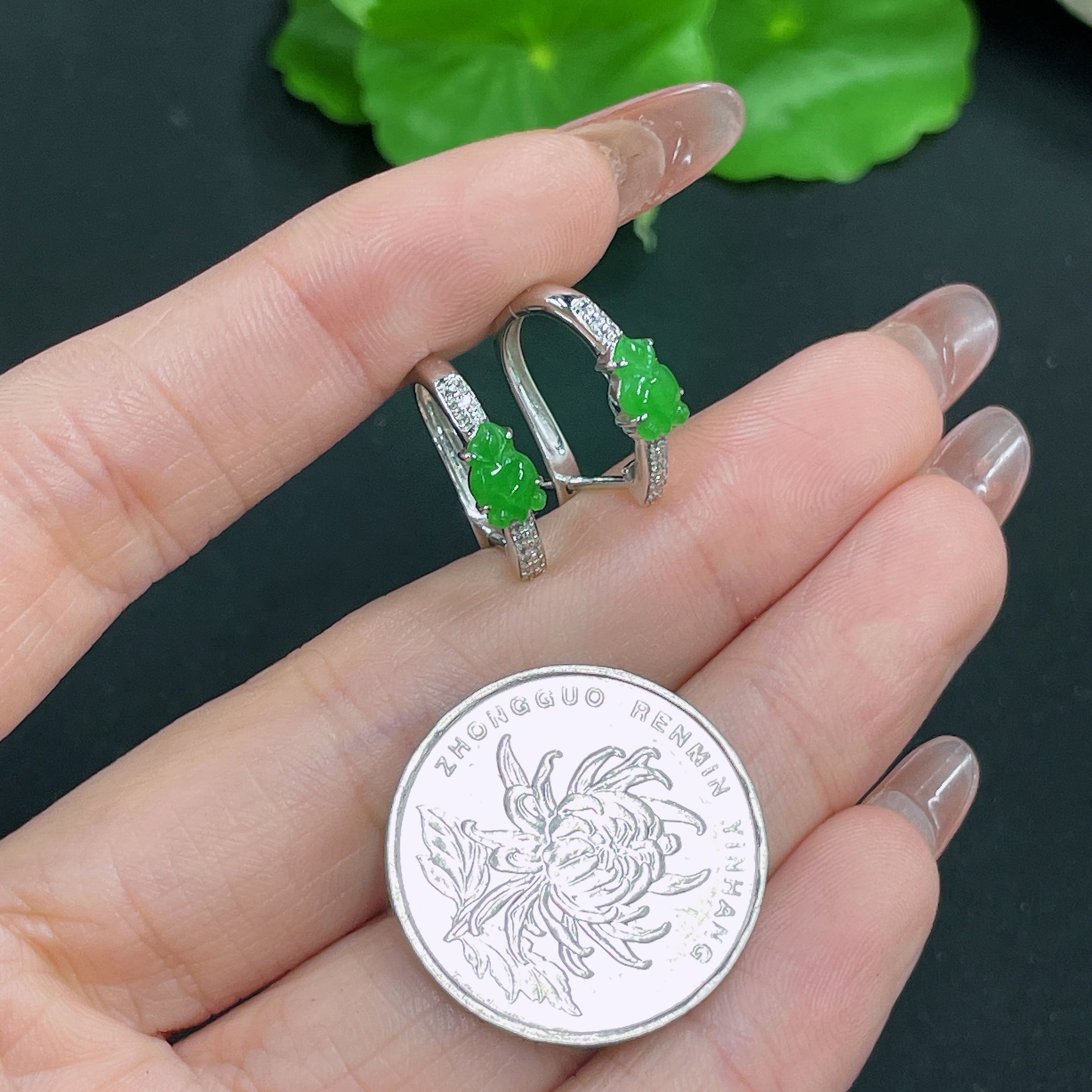 HUILIU HQ jadeite earrings set in 18k gold with diamond accents, showcasing elegant green jade jewelry on a white background.