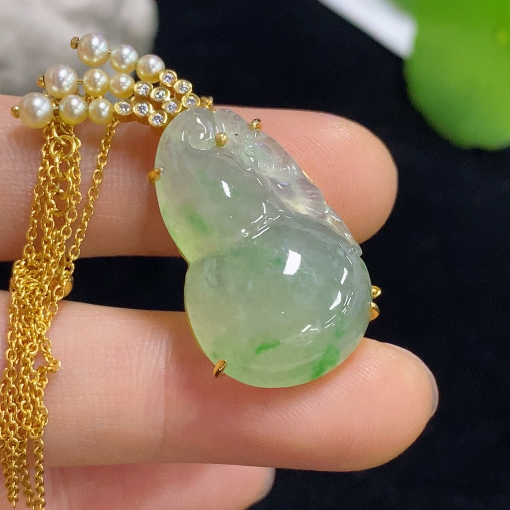 Jadeite gourd pendant set in 18k gold with diamond accents, total weight approximately 8.15g (including chain)