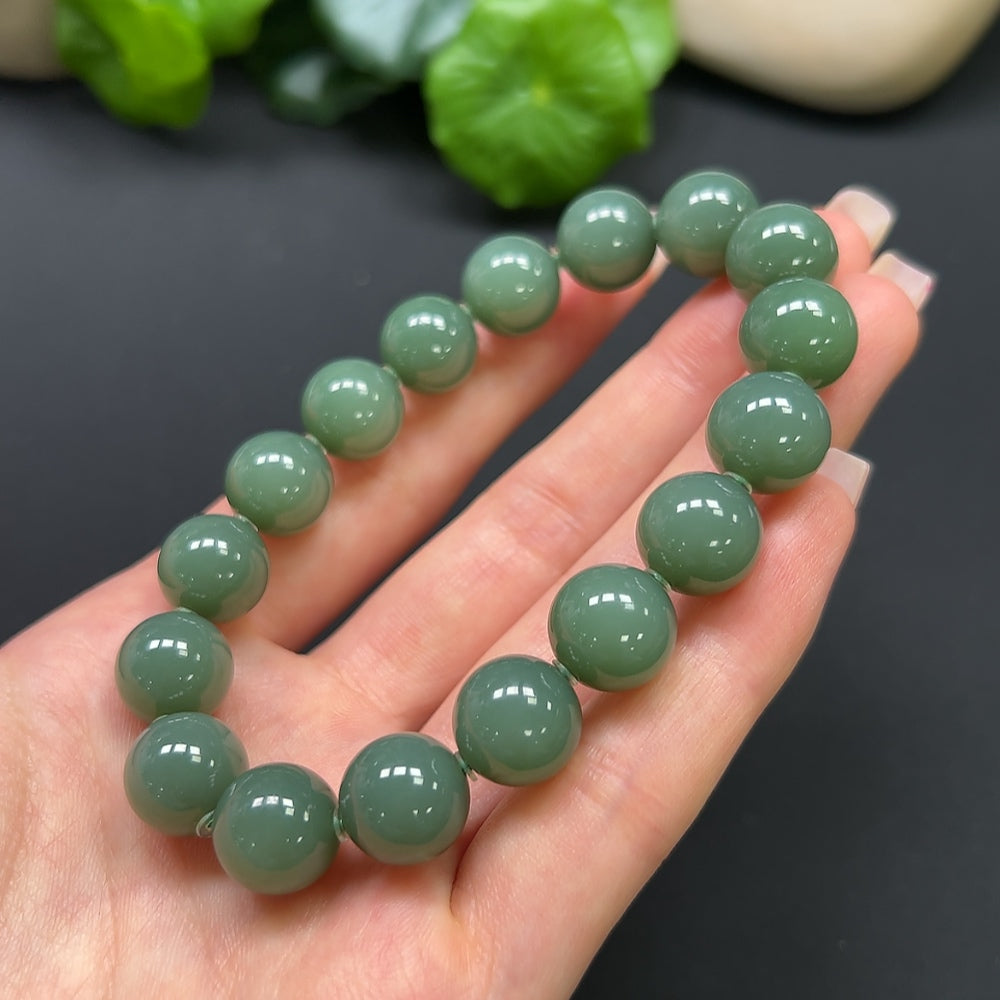 Elegant Hetian Jade bracelet from HKHQ, featuring smooth green jade beads, weighs 45g, perfect for stylish jewelry collection.