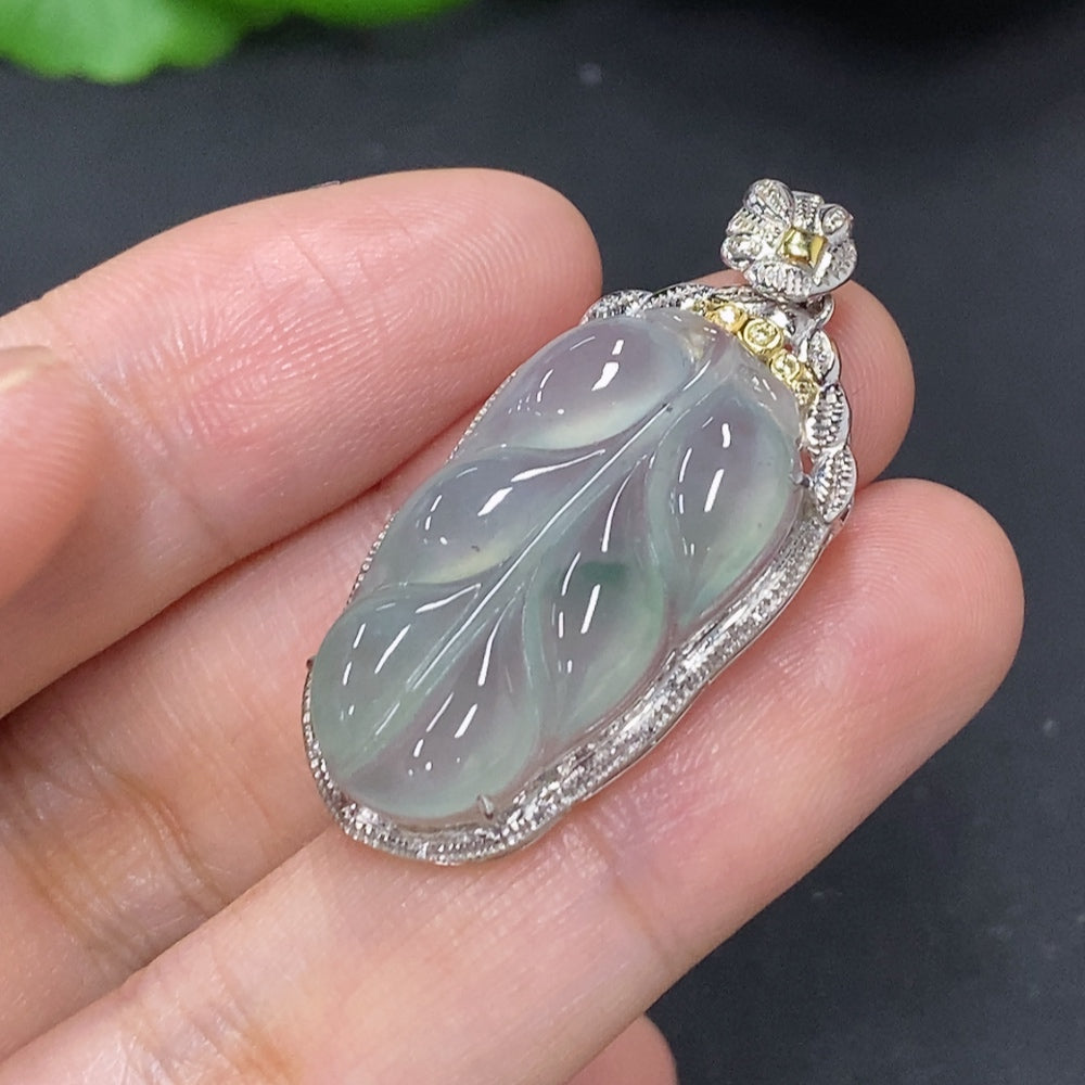 Jadeite leaf inlay pendant with 18K gold setting, HKHQ necklace, showcasing intricate leaf design and polished finish.