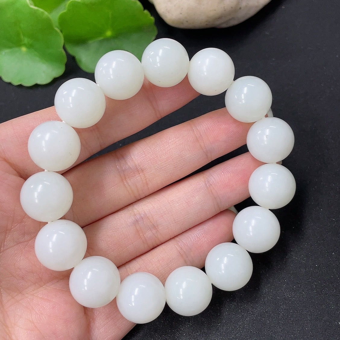 HKHQ Hetian Jade bracelet with 13.6mm beads, weighing approximately 62g, showcasing smooth, polished jade stones.