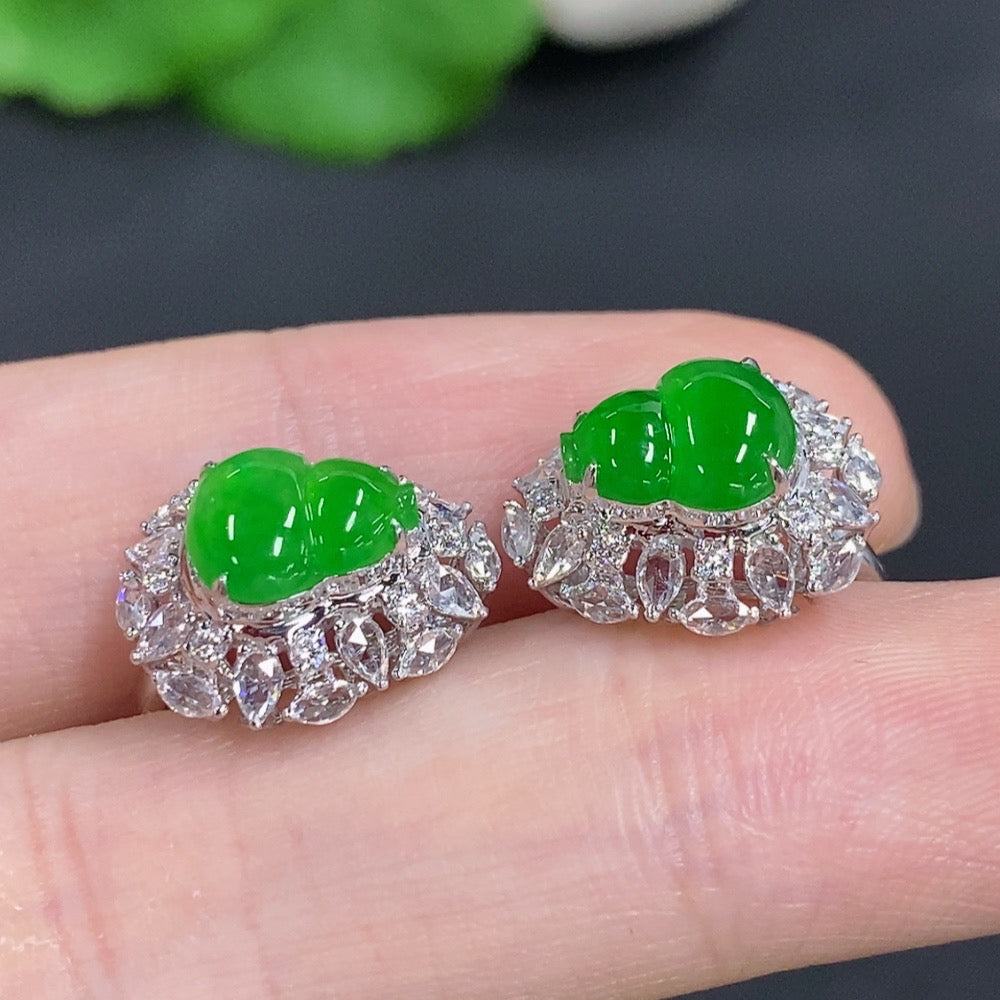 Jadeite gourd earrings in 18K gold with diamond accents, featuring elegant drop design and intricate craftsmanship.