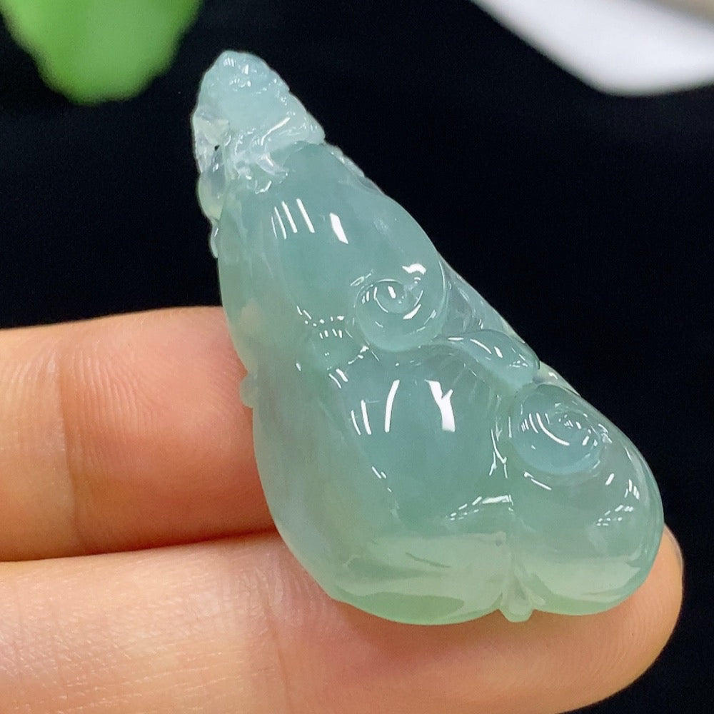 Huiliu Jadeite Ruyi pendant with carved design, certified by Huiliu, showcasing smooth green jade craftsmanship.