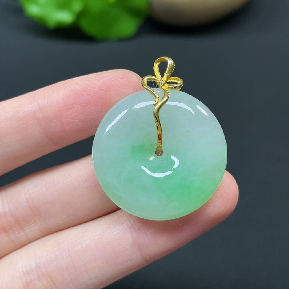 Jadeite Peace Knot pendant with 18k gold, diamond side stones, featuring intricate inlay design, weighing approximately 10.92g.
