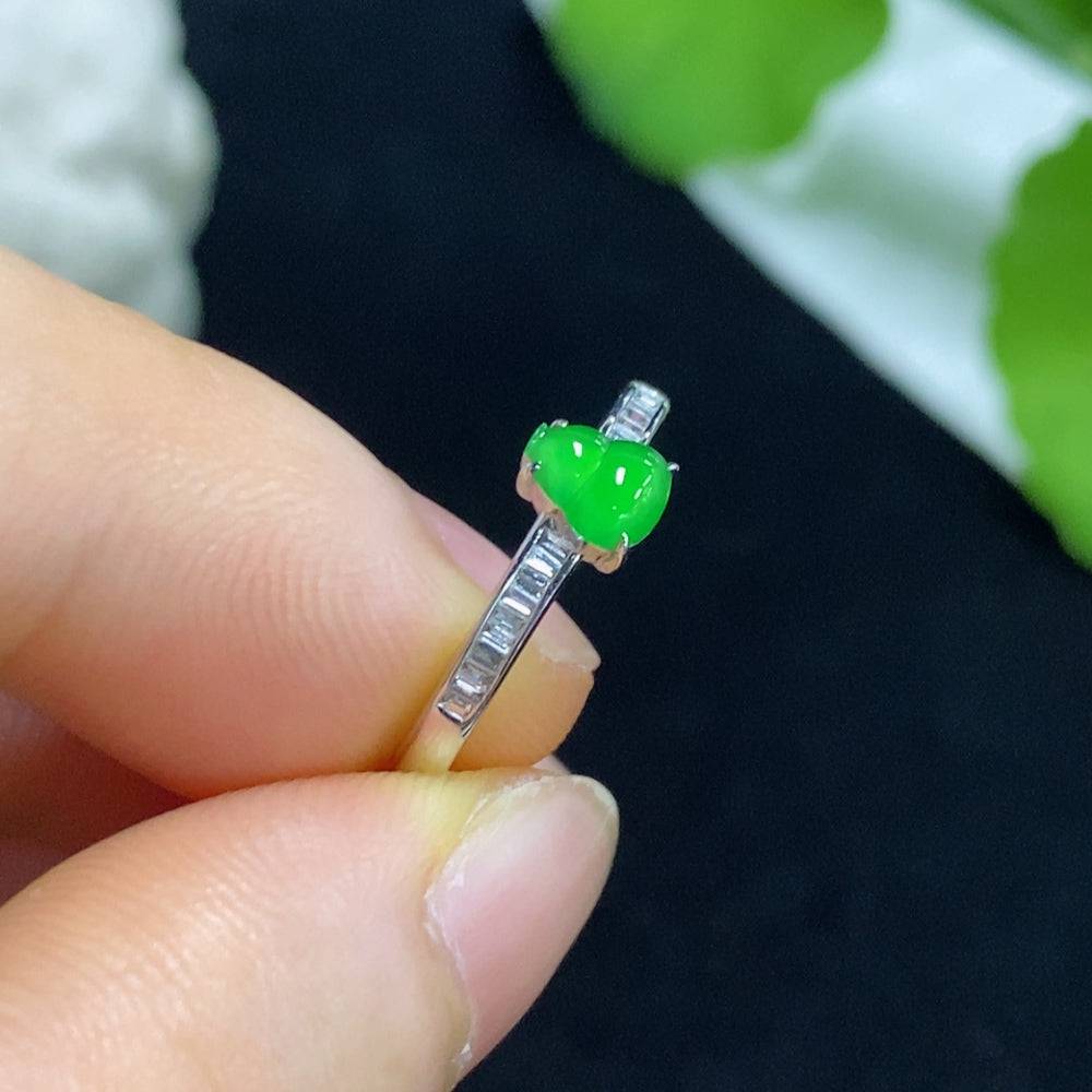 Huiliu Jadeite gourd ring with diamond accents, featuring intricate inlay work and a polished green jade surface.