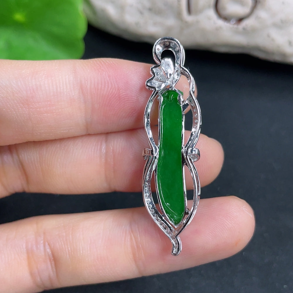 Elegant jadeite pendant with 18K gold setting and diamonds, displayed on a necklace chain.