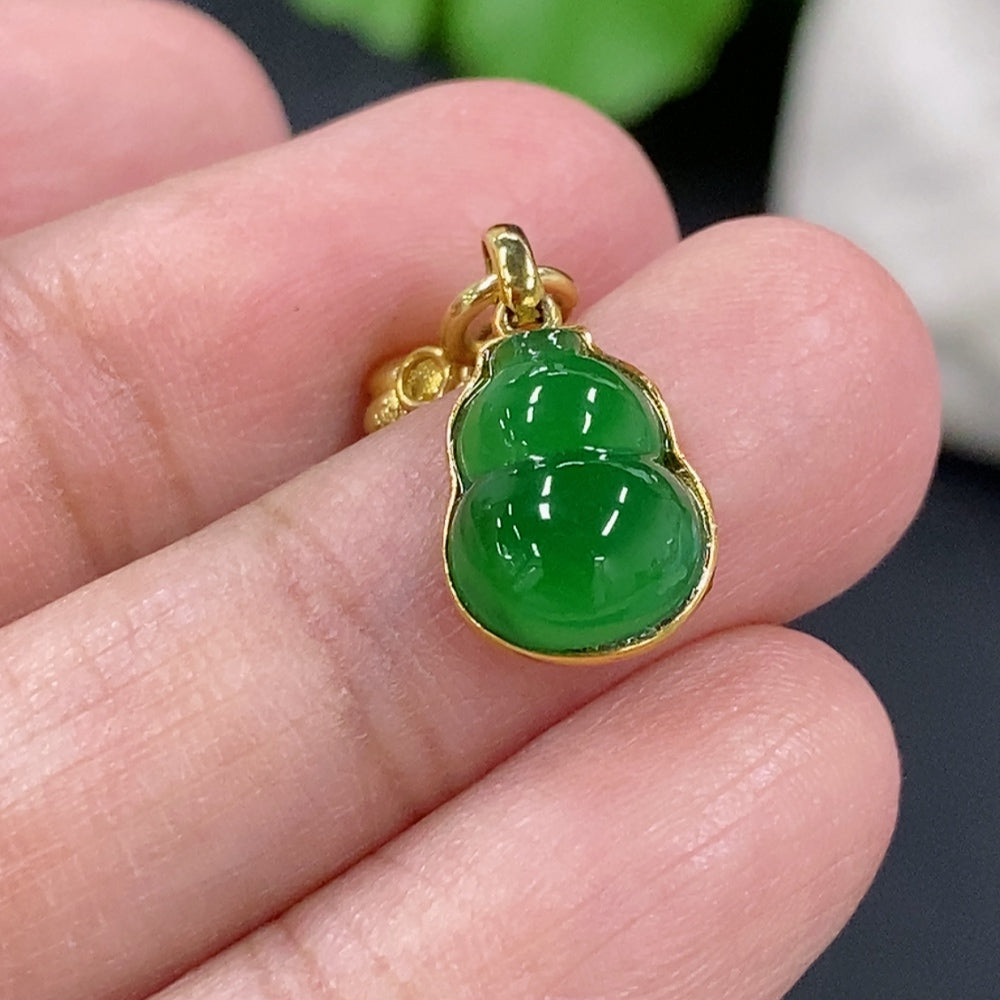 Jadeite gourd pendant necklace with 18K gold setting, showcasing a polished green jadeite stone on a delicate chain.