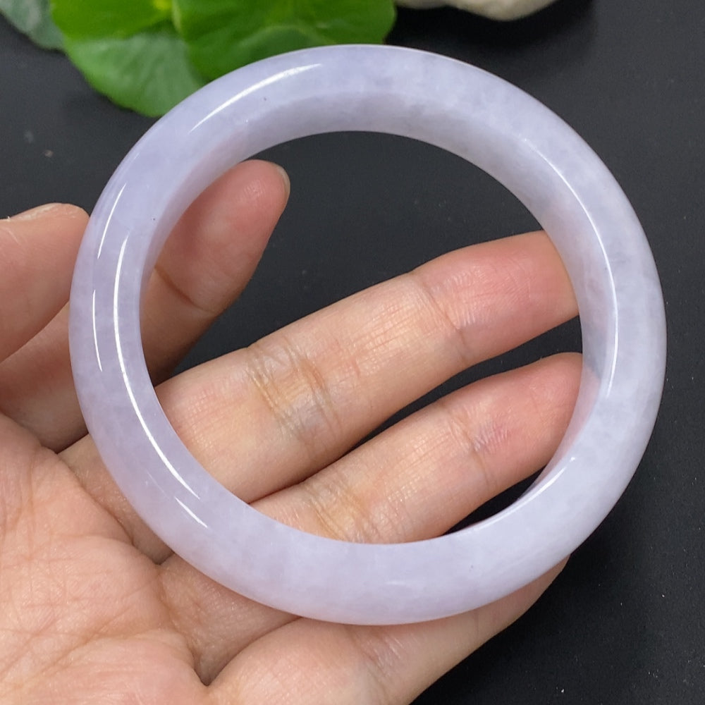 HKHQ jadeite round bangle, size 56.6, weighing approx. 67.5g, showcasing a smooth, polished green jadeite bracelet.