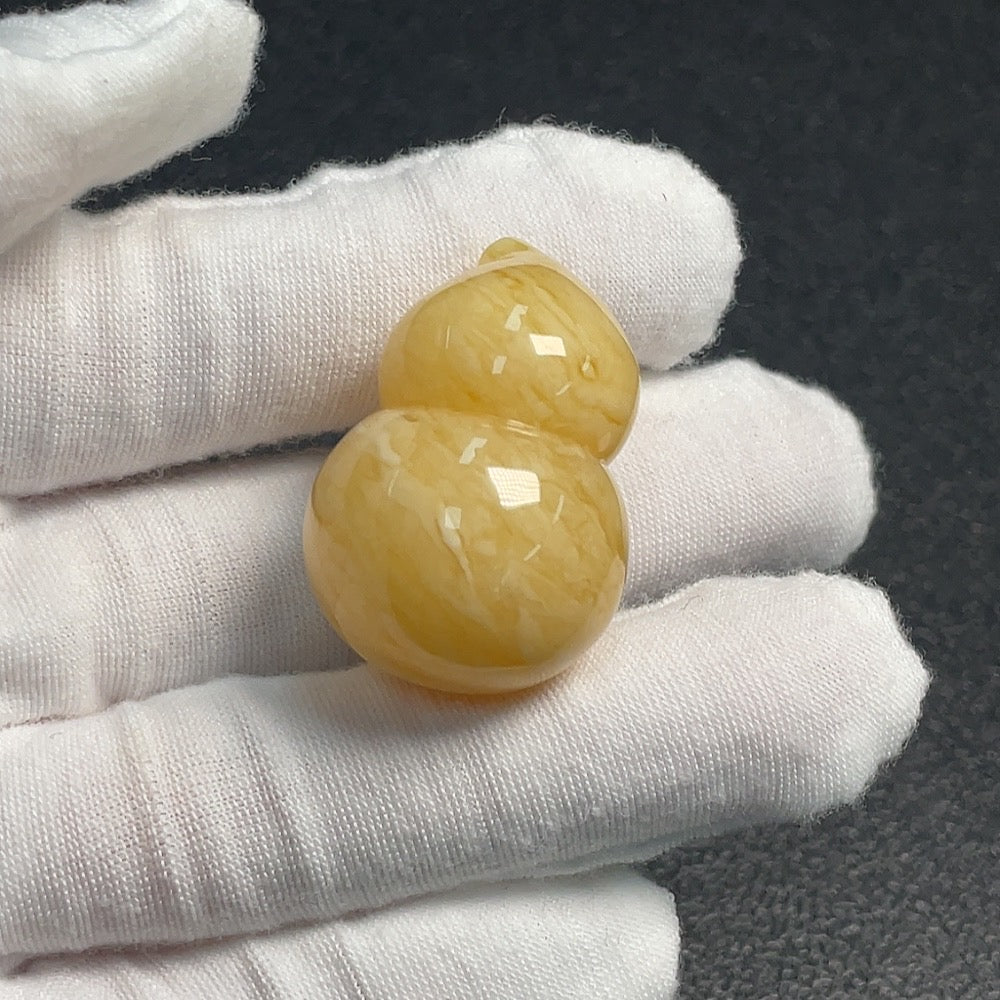 Huiliu Certified amber beeswax jewelry featuring natural amber beads on a delicate string.