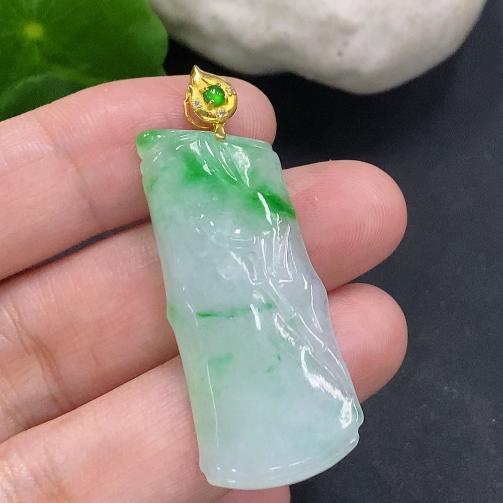 Jadeite bamboo pendant with 18K gold clasp, showcasing green jade and gold details, weighs approximately 7.1 grams.