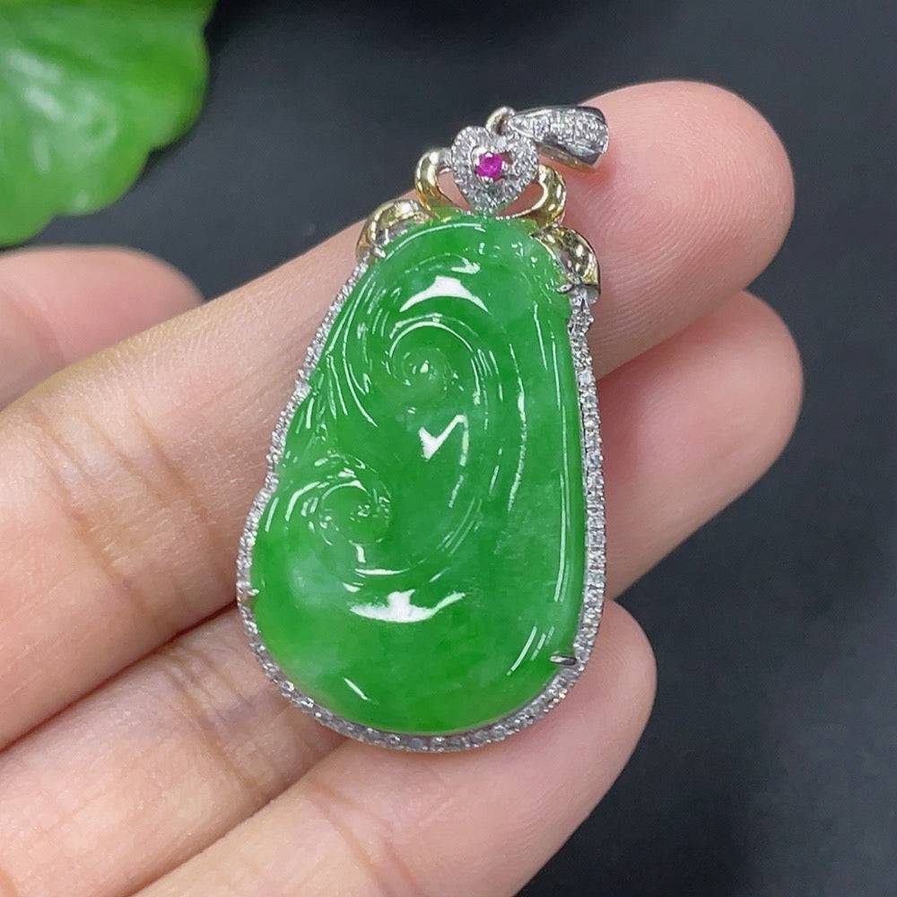 Jadeite inlaid Ruyi pendant with 18k gold setting and diamonds, showcasing intricate jewelry craftsmanship.
