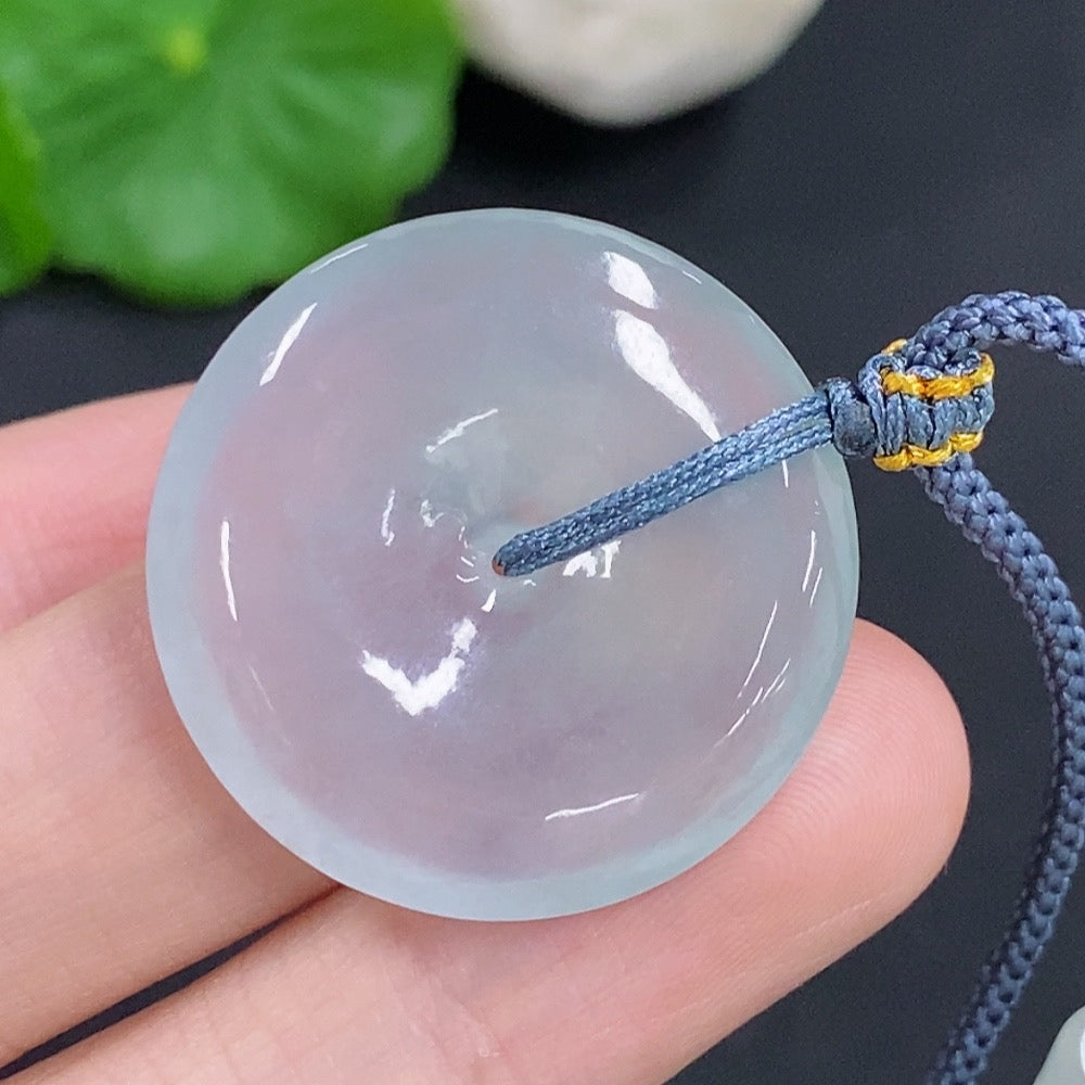 Jadeite safety pendant necklace by HKHQ featuring a smooth green jadeite stone on a delicate chain.