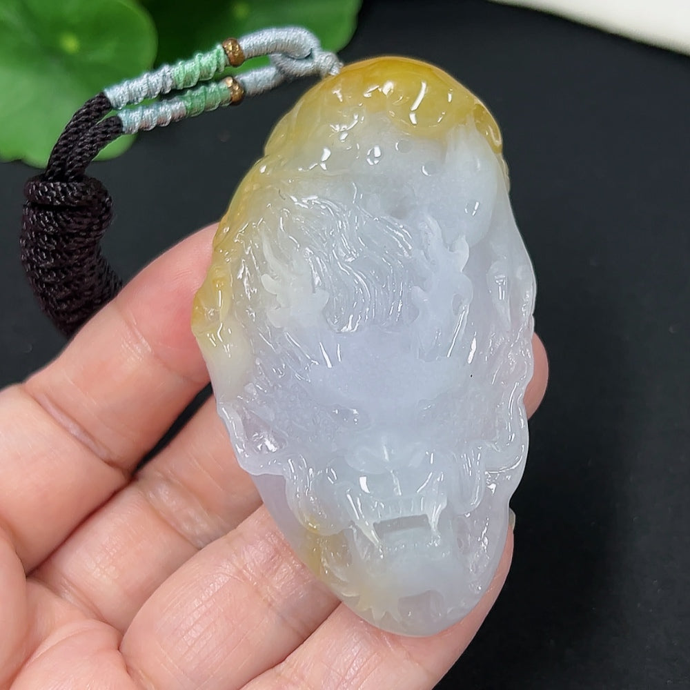 Jadeite dragon pendant with rope, crafted from green jade, weighing approximately 53.8g, featuring intricate dragon detail.