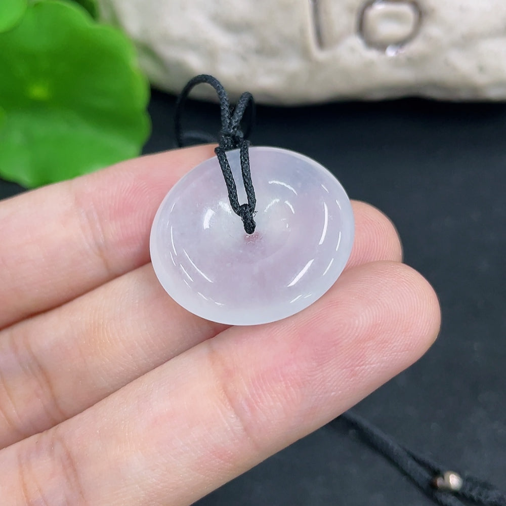 Jadeite pendant weighing approximately 6.8g, featuring a smooth, polished green gemstone on a necklace, by HKHQ
