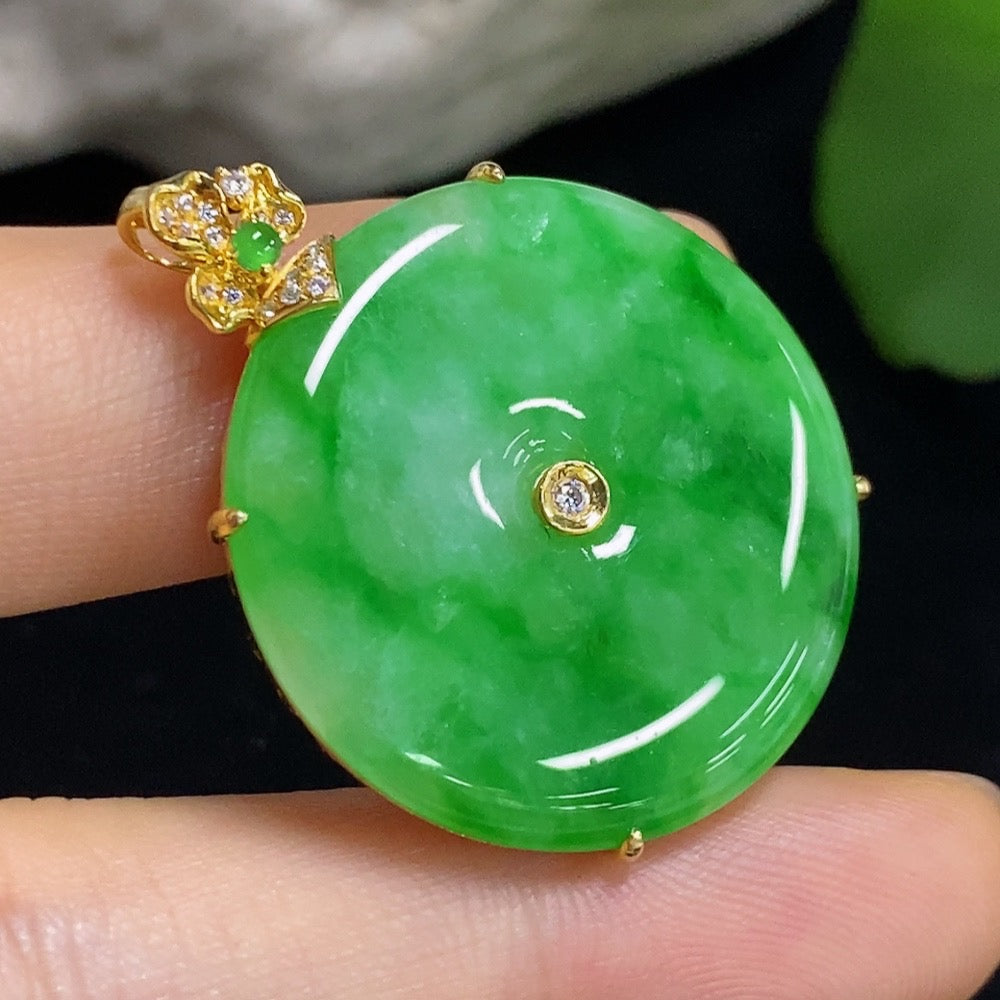 Jadeite safety buckle pendant necklace by HKHQ featuring a gold clasp, non-diamond design, on a delicate chain.